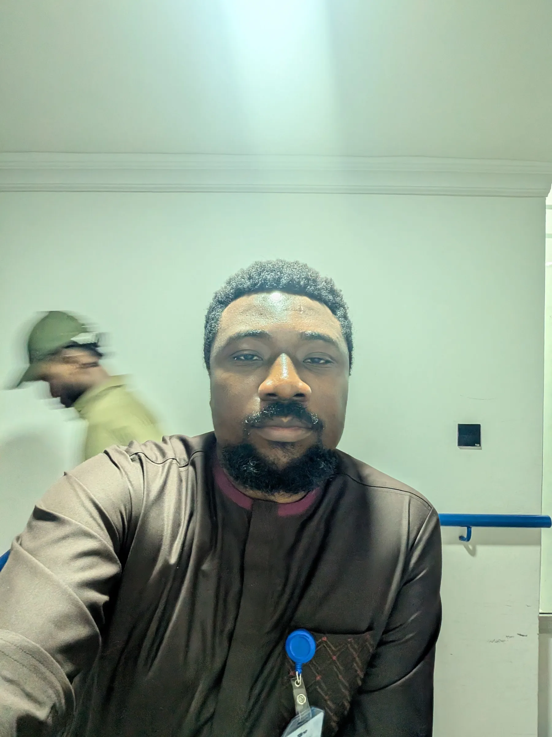 Isaac Olanrewaju in a work setting